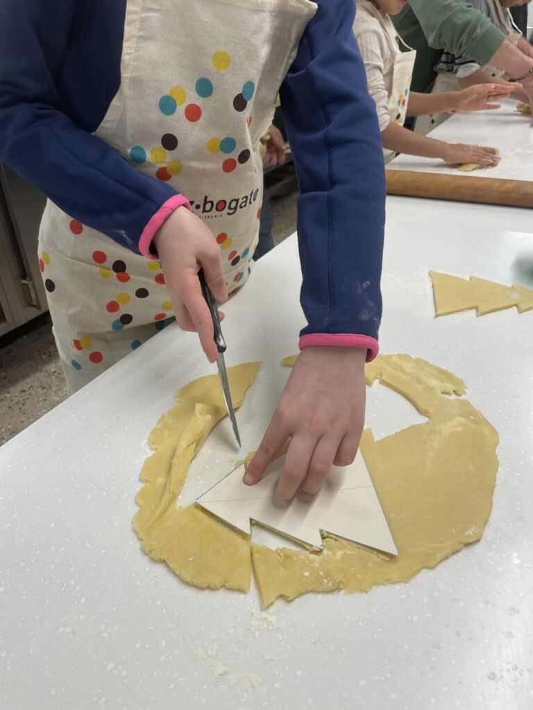 child working with dough