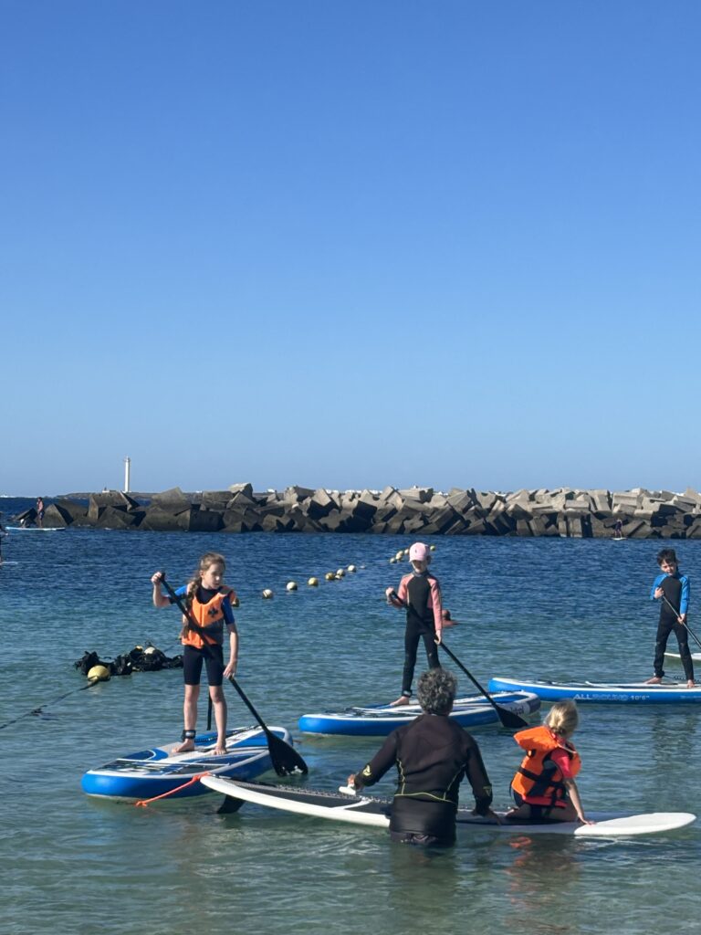 flamingo beach lanzarote, stand up paddling kids